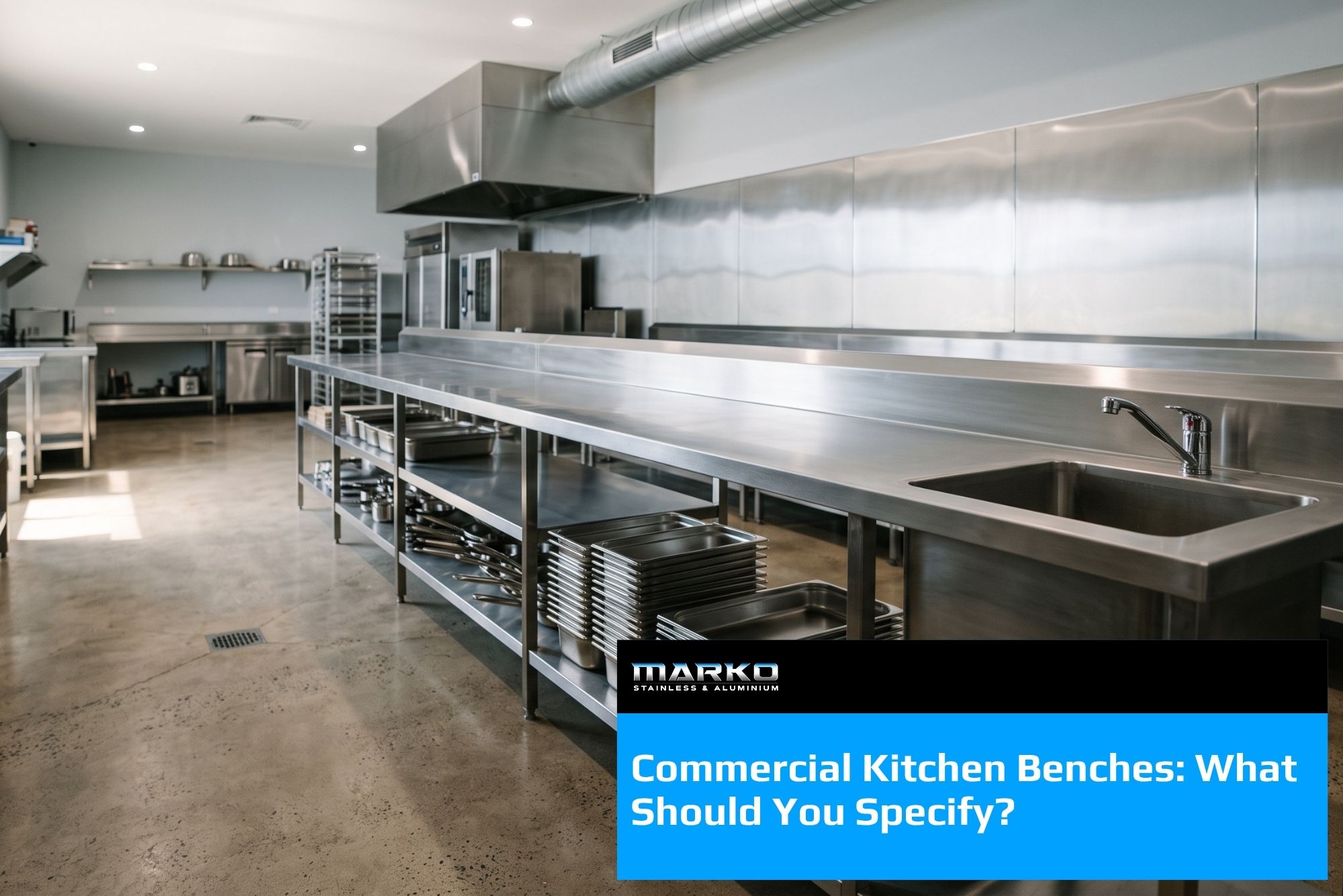 Blog - Commercial kitchen bench in stainless steel with undershelf holding gastronorm pans, plus integrated sink and tapware